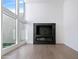 Bright living room with a modern fireplace and large windows at 4825 N 72Nd Way, Scottsdale, AZ 85251