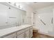 Clean bathroom, featuring a walk-in shower and updated vanity at 4842 E Surrey Ave, Scottsdale, AZ 85254