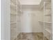 Large walk-in closet with ample shelving at 4842 E Surrey Ave, Scottsdale, AZ 85254