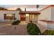 Front entry with red door and tile walkway at 4842 E Surrey Ave, Scottsdale, AZ 85254