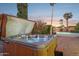 Relaxing hot tub with open cover, nestled beside a refreshing swimming pool at 4842 E Surrey Ave, Scottsdale, AZ 85254