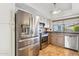 Kitchen with stainless steel refrigerator and dishwasher at 4842 E Surrey Ave, Scottsdale, AZ 85254