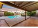 Relaxing covered patio overlooking the refreshing pool at 4842 E Surrey Ave, Scottsdale, AZ 85254