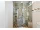 Large walk-in shower with glass enclosure and built-in seat at 4842 E Surrey Ave, Scottsdale, AZ 85254