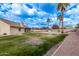 Spacious backyard with grassy lawn and swimming pool at 4963 E Hobart St, Mesa, AZ 85205