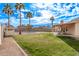 Large backyard with grassy area, covered patio and pool at 4963 E Hobart St, Mesa, AZ 85205