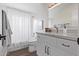 Modern bathroom with white vanity and shower at 4963 E Hobart St, Mesa, AZ 85205