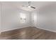 Bedroom with ceiling fan and wood-look floors at 4963 E Hobart St, Mesa, AZ 85205