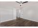 Bright bedroom with ceiling fan and carpet at 4963 E Hobart St, Mesa, AZ 85205