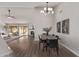 Open concept dining room with wood table and view of living room and kitchen at 4963 E Hobart St, Mesa, AZ 85205