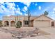 Single-story home with desert landscaping and two-car garage at 4963 E Hobart St, Mesa, AZ 85205