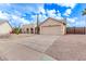 House exterior showcasing desert landscaping and a gated driveway at 4963 E Hobart St, Mesa, AZ 85205