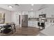 Modern kitchen with stainless steel appliances and white cabinets at 4963 E Hobart St, Mesa, AZ 85205