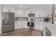 Modern kitchen with white cabinets, stainless steel appliances and a farmhouse sink at 4963 E Hobart St, Mesa, AZ 85205