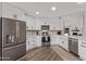 Modern kitchen featuring stainless steel appliances and white shaker cabinets at 4963 E Hobart St, Mesa, AZ 85205