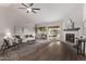 Living room with vaulted ceilings, fireplace and hardwood floors at 4963 E Hobart St, Mesa, AZ 85205