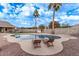 Relaxing kidney-shaped pool with lounge chairs at 4963 E Hobart St, Mesa, AZ 85205