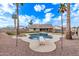 Inviting kidney-shaped pool with diving board and lounge chairs at 4963 E Hobart St, Mesa, AZ 85205