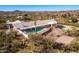 Aerial view of house with pool, desert landscape, and distant mountains at 51008 N 295Th Ave, Wickenburg, AZ 85390