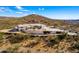 Aerial view of house with pool and mountain views at 51008 N 295Th Ave, Wickenburg, AZ 85390