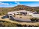 Aerial view of a home with a long driveway and desert landscape at 51008 N 295Th Ave, Wickenburg, AZ 85390