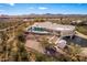 Aerial view of house, pool, and surrounding desert landscape at 51008 N 295Th Ave, Wickenburg, AZ 85390