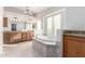 Elegant bathroom featuring a double vanity, soaking tub, and ample storage at 51008 N 295Th Ave, Wickenburg, AZ 85390