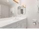 Bathroom with white vanity, large mirror, and tiled floor at 51008 N 295Th Ave, Wickenburg, AZ 85390