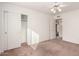 Well-lit bedroom with ceiling fan and sliding door to patio at 51008 N 295Th Ave, Wickenburg, AZ 85390