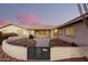 Front entrance with gate and landscaping at 51008 N 295Th Ave, Wickenburg, AZ 85390