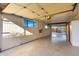 Well-lit garage with overhead door and storage at 51008 N 295Th Ave, Wickenburg, AZ 85390