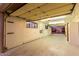 Large garage with pegboard walls and overhead storage at 51008 N 295Th Ave, Wickenburg, AZ 85390