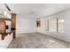 Kitchen with breakfast bar, tile floors and wood cabinetry at 51008 N 295Th Ave, Wickenburg, AZ 85390