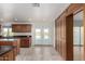 Kitchen with island, wood cabinets, and granite countertops at 51008 N 295Th Ave, Wickenburg, AZ 85390