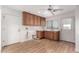 Laundry room with wood cabinets, sink, and exterior access at 51008 N 295Th Ave, Wickenburg, AZ 85390