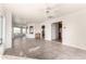 Sunlit living room with tile flooring and access to the outside at 51008 N 295Th Ave, Wickenburg, AZ 85390