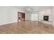 Bright living room featuring a fireplace and built-in shelving at 51008 N 295Th Ave, Wickenburg, AZ 85390