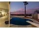 Stunning pool and patio area with mountain views at sunset at 51008 N 295Th Ave, Wickenburg, AZ 85390