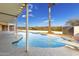 Inviting pool with a diving board, expansive patio, and mountain views at 51008 N 295Th Ave, Wickenburg, AZ 85390