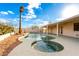 Relaxing kidney-shaped pool with spa and covered patio at 51008 N 295Th Ave, Wickenburg, AZ 85390