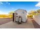 White storage shed with propane tank and mountain view at 51008 N 295Th Ave, Wickenburg, AZ 85390