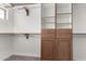 Large walk-in closet with custom built-ins and ample shelving at 51008 N 295Th Ave, Wickenburg, AZ 85390