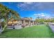 Spacious backyard with covered patio and fruit trees at 5133 W Monte Cristo Ave, Glendale, AZ 85306