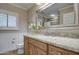 Bathroom with granite countertop, single sink, and a large mirror at 5133 W Monte Cristo Ave, Glendale, AZ 85306