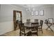 Round dining table with chandelier and decorative mirror at 5133 W Monte Cristo Ave, Glendale, AZ 85306