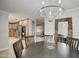 Charming dining room with a round table and chandelier at 5133 W Monte Cristo Ave, Glendale, AZ 85306