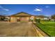 Three-car garage and well-maintained landscaping at 5133 W Monte Cristo Ave, Glendale, AZ 85306