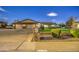 Three-car garage with stone accents and curb appeal at 5133 W Monte Cristo Ave, Glendale, AZ 85306