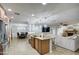 Open concept kitchen with island and views into living room at 5133 W Monte Cristo Ave, Glendale, AZ 85306