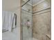 Large shower with glass enclosure and tile surround at 5133 W Monte Cristo Ave, Glendale, AZ 85306